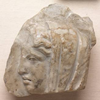 Relief fragment with head of a woman