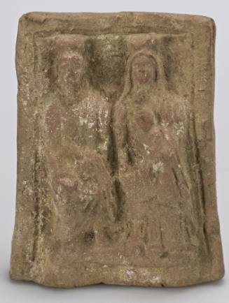 Votive relief of husband and wife with child