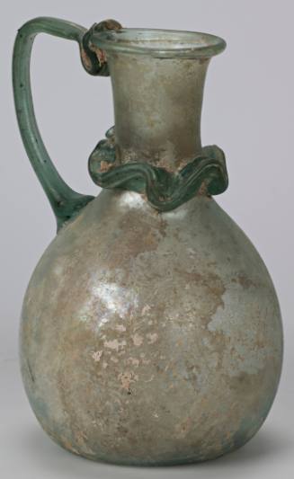 Jug with ovoid body, trailed glass decoration at neck and trailed glass handle, concave base; folded lip