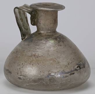 Roman bottle with conical body, concave base, flattened rim, and wide ribbon handles
