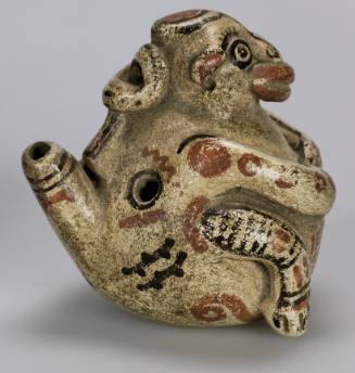 Whistle in form of a seated monkey