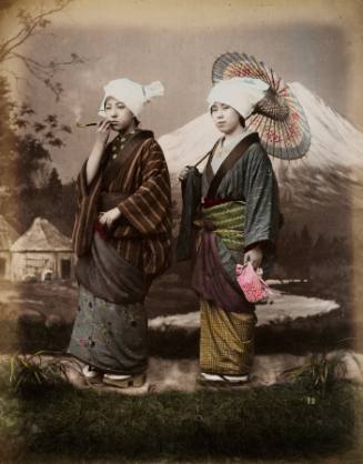 Two Women before Painted Backdrop of Mount Fuji