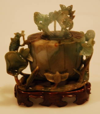 Green agate covered lotus form jar with wooden stand