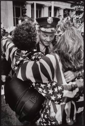 Two Women Embrace a Fire Fighter in Uniform, World Trade Center, New York, City, USA