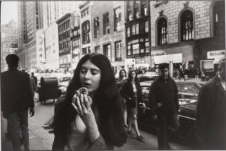Untitled, from Women are Beautiful [Young Woman Eating a Pretzel]