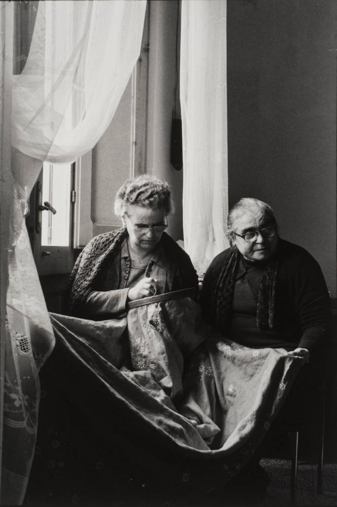 Two matrons embroidering by the window, Sicily, Italy