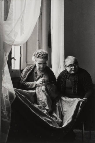Two matrons embroidering by the window, Sicily, Italy