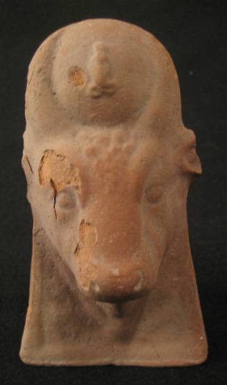 Head of the cow Goddess Hathor wearing the disk with uraeus
