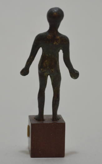 Statuette of an athlete, clasping unidentified objects in his hands