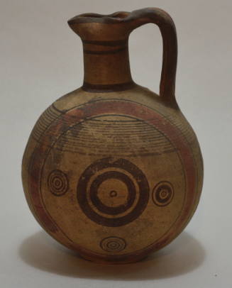 Cypriot oinochoe with brown and red painted decoration of concentric circles and bands