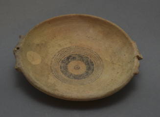 Cypriot plate with lateral handles, decorated with red and brown concentric circles