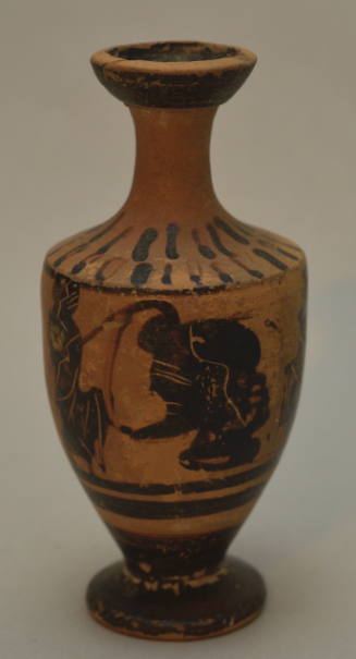 Attic (?) black-figure lekythos decorated with a profile head flanked by two small draped figures