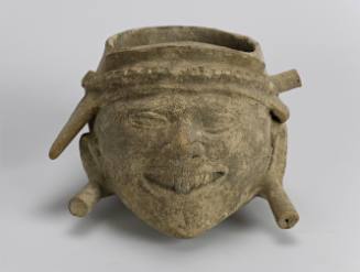 Vessel in form of head with plugs and headdress