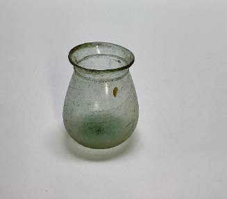 Roman beaker with wide mouth with trailed ridge below lip, slightly concave base