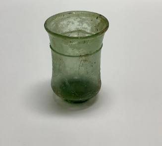 Roman beaker with concave body and thread encircling beneath the rim