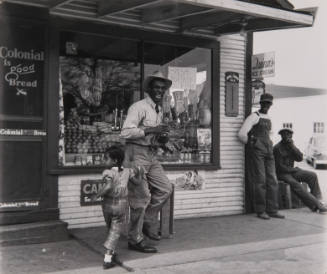 Man Laughing in Front of General Store, Mississippi
