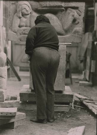 Diego Rivera in front of sculpture
