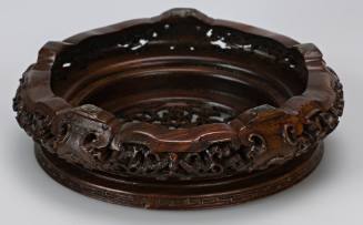 Carved stand for brush jar