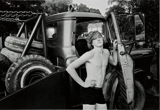 Donald York, Jr. standing beside his father’s wrecker, Millerton, New York, from the series and book, A Kind of History