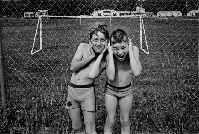 Ricky Boise and Tommy Cuddeback ‘exchanging heads’ at the soccer field next to the community swimming pool, Millerton, New York, from the series and book, A Kind of History