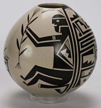 Black-on-white pot with Mimbres designs