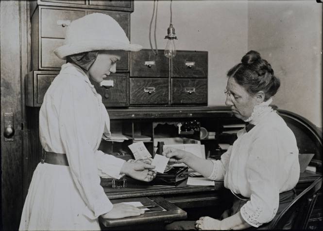 Untitled (Woman at desk with young girl)