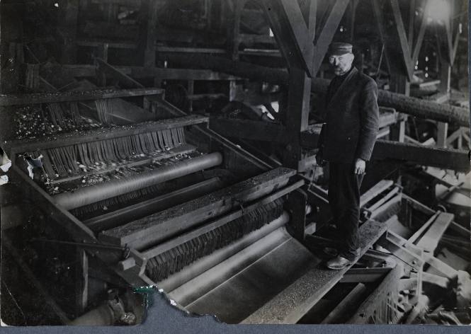 Untitled (Man standing on sorter)