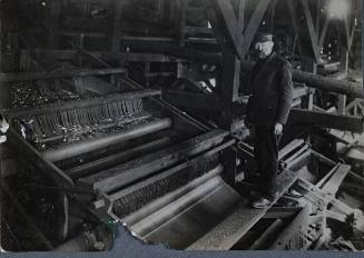 Untitled (Man standing on sorter)