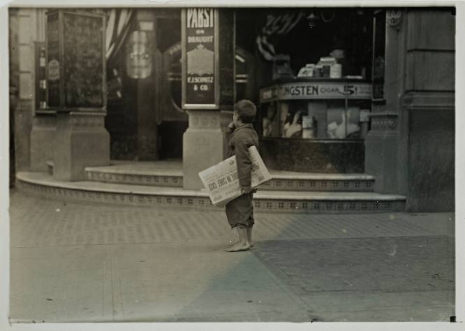 Untitled (Barefoot child with “Evening Standard” under his arm)