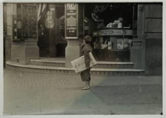 Untitled (Barefoot child with “Evening Standard” under his arm)