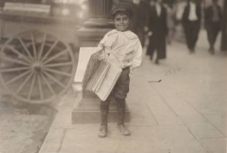 Untitled (Newsie with bundle of papers)