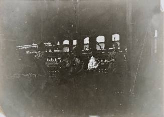 Lincoln Cotton Mills, Evansville, Indiana, Boy Sweeping and Small Girl Picking Up and Carting Away (Bad Light and Shaking Floors)
