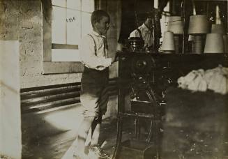 Untitled (Boy making string)