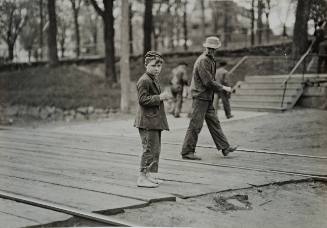 Untitled (Boy on railroad tracks)