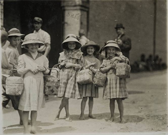 Untitled (Children in hats with baskets)