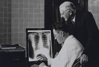 Untitled (Doctors examining chest x-ray)