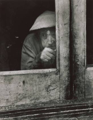 Untitled (Man peering out window)