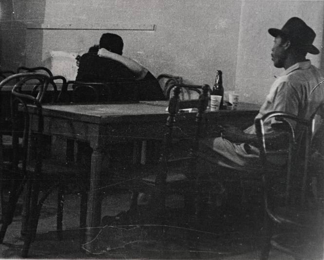 Untitled (Profile of man at table with beer bottle)