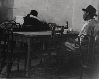 Untitled (Profile of man at table with beer bottle)