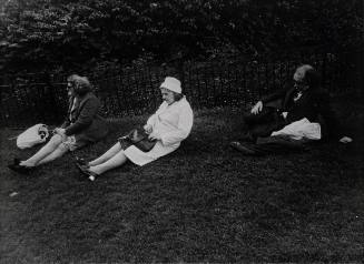 Untitled (Three people sitting on lawn facing left)