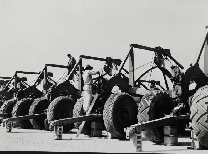 Army service forces loading heavy equipment