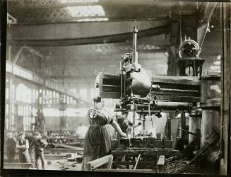 Women at battery drills, drilling angle and "T" bars for ribs of airship sheds