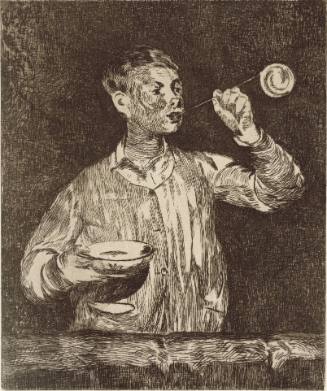 Boy Blowing Soap Bubbles
