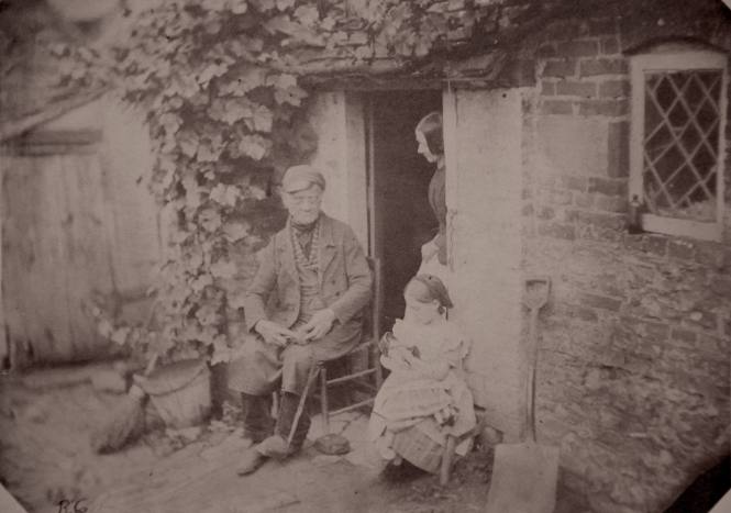 Family at Cottage Door