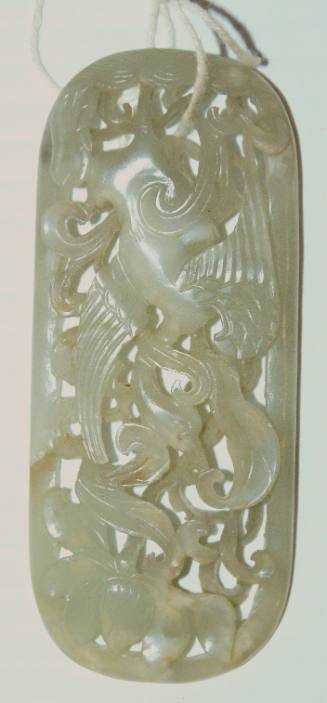 Jade reticulated scepter ornament of oval form carved with a crane in a lotus pond