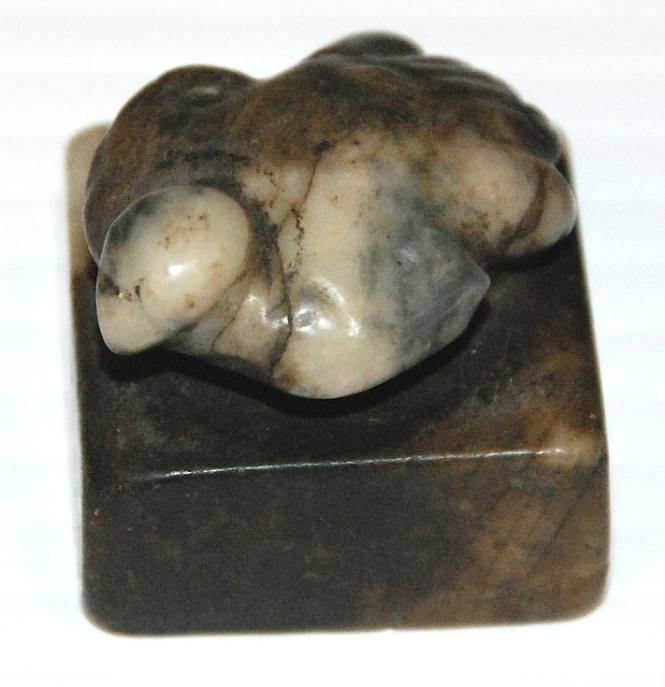 Jade square block chop seal, surmounted by a dove with spread wings and tail