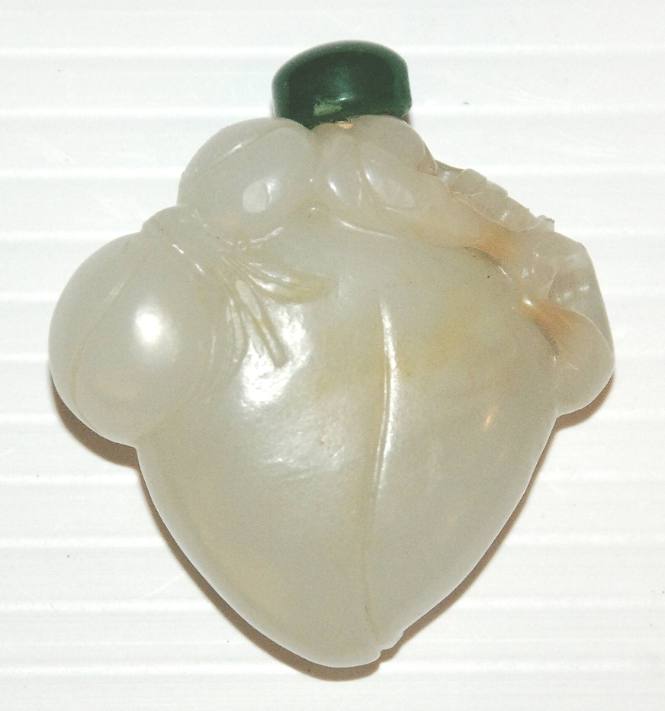 White jade peach snuff bottle with green glass stopper