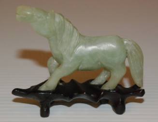 Serpentine statuette of a horse with a wooden stand