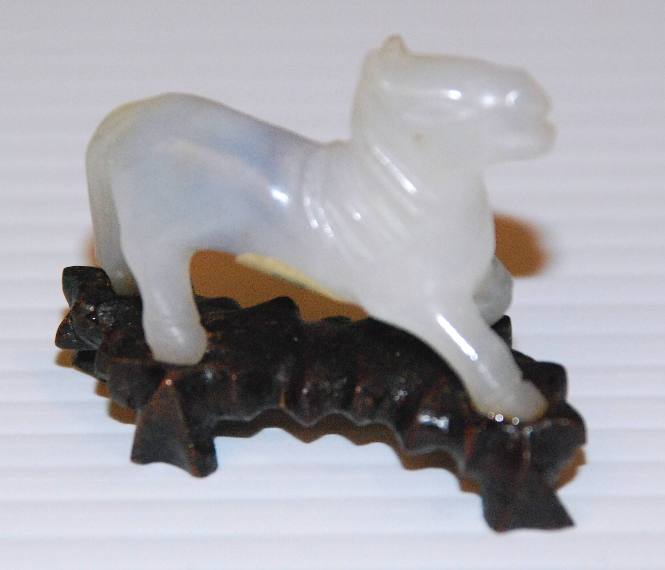 Jadeite miniature of running horse with wooden stand
