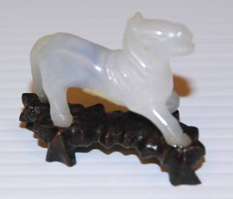 Jadeite miniature of running horse with wooden stand